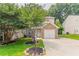Charming brick-accented two-story home featuring a well-manicured front lawn and a single-car garage at 7070 Ravenwood Ln, Lithonia, GA 30038