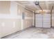 Spacious two car garage with drywall and an automatic door opener at 7070 Ravenwood Ln, Lithonia, GA 30038