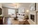 Cozy living room with fireplace, stylish furniture, and a serene ambiance at 7070 Ravenwood Ln, Lithonia, GA 30038