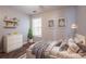 Cozy main bedroom with shelves, window, and neutral decor at 7070 Ravenwood Ln, Lithonia, GA 30038