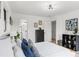 Bright bedroom with neutral walls, a modern light fixture, and ensuite bathroom at 1066 Cleavemark Dr, Clarkston, GA 30021