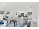 Open-concept living space with modern furnishings, including a kitchen island and dining area at 1066 Cleavemark Dr, Clarkston, GA 30021