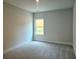 Bedroom featuring soft carpet, a single window, and neutral-toned walls at 195 Silvercrest Dr, Acworth, GA 30101