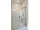 Shower features frameless glass door, white marble-patterned tile, and black hardware at 195 Silvercrest Dr, Acworth, GA 30101