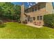 Lush backyard with patio, grill, and outdoor seating, perfect for entertaining at 939 Bendleton Dr, Woodstock, GA 30188