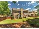Spacious backyard featuring a well-maintained lawn, mature trees, and a privacy fence at 939 Bendleton Dr, Woodstock, GA 30188