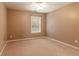 Bedroom featuring neutral carpet, fresh paint and a bright window for natural lighting at 939 Bendleton Dr, Woodstock, GA 30188