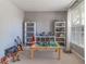 Neutral-toned bedroom showcasing built-in shelving filled with displays and natural light at 939 Bendleton Dr, Woodstock, GA 30188