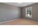 This is a bedroom with carpet flooring and a window that provides natural light at 939 Bendleton Dr, Woodstock, GA 30188