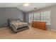 Spacious bedroom with vaulted ceilings, neutral tones, and ample natural light at 939 Bendleton Dr, Woodstock, GA 30188