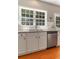 Kitchen showcasing stainless steel dishwasher, sink and ample natural light at 939 Bendleton Dr, Woodstock, GA 30188