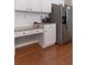 Kitchen featuring granite counters, stainless steel appliances, and custom white cabinetry at 939 Bendleton Dr, Woodstock, GA 30188