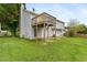 The backyard shows a lawn, an elevated wooden deck, and the home's exterior at 946 Redan Trce, Stone Mountain, GA 30088