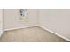 Bedroom showcasing carpet floors and a window with natural light at 946 Redan Trce, Stone Mountain, GA 30088