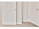Carpeted bedroom with white painted doors and neutral walls at 946 Redan Trce, Stone Mountain, GA 30088