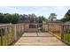 Wooden deck with a view of the wooded backyard at 946 Redan Trce, Stone Mountain, GA 30088