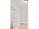 Hallway featuring multiple doorways, neutral walls, and new carpet at 946 Redan Trce, Stone Mountain, GA 30088
