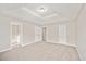 Bedroom featuring plush carpet and a trey ceiling at 946 Redan Trce, Stone Mountain, GA 30088