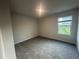 Cozy bedroom with neutral carpet, window, and ample natural light at 11045 Shadow Creek Ter, Hampton, GA 30228