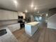 Beautiful kitchen featuring white cabinets, stainless steel appliances, granite countertops, and breakfast bar at 11045 Shadow Creek Ter, Hampton, GA 30228
