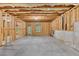 Unfinished basement showing the walls, window, and door to the outside at 118 Hardy Water Dr, Lawrenceville, GA 30045