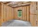 Unfinished basement showing the walls and a window at 118 Hardy Water Dr, Lawrenceville, GA 30045