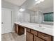 Bathroom features double sinks, dark wood cabinets, shower and natural light at 118 Hardy Water Dr, Lawrenceville, GA 30045