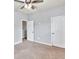 Spacious bedroom with two white doors and carpet flooring at 118 Hardy Water Dr, Lawrenceville, GA 30045