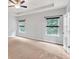 Large bedroom includes two windows, neutral walls, ceiling fan and carpeted floors at 118 Hardy Water Dr, Lawrenceville, GA 30045
