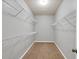 Walk-in closet with ample shelving and carpeted floor at 118 Hardy Water Dr, Lawrenceville, GA 30045