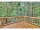 Wooden deck with a view of a wooded area at 118 Hardy Water Dr, Lawrenceville, GA 30045