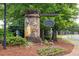 Stone entrance to The Springs at Rockhouse community with manicured landscaping and a decorative sign at 118 Hardy Water Dr, Lawrenceville, GA 30045