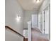 Hallway with carpeted floor leads to bedrooms and bathrooms at 118 Hardy Water Dr, Lawrenceville, GA 30045