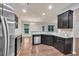 Modern kitchen features stainless steel appliances and granite countertops at 118 Hardy Water Dr, Lawrenceville, GA 30045