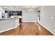 Modern kitchen with dark cabinets and stainless appliances in this open living space at 118 Hardy Water Dr, Lawrenceville, GA 30045