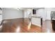 Spacious open-concept living area features hardwood floors and a modern kitchen at 118 Hardy Water Dr, Lawrenceville, GA 30045