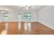 Bright and spacious living room with hardwood floors and large windows at 118 Hardy Water Dr, Lawrenceville, GA 30045