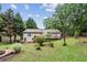 An expansive backyard features a wood deck and firepit, ideal for outdoor gatherings and relaxation at 1185 Wedgefield Sw Dr, Marietta, GA 30064