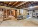 Unfinished basement with concrete floor and exposed pipes at 1185 Wedgefield Sw Dr, Marietta, GA 30064