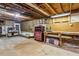 Unfinished basement with concrete floor and exposed beams at 1185 Wedgefield Sw Dr, Marietta, GA 30064