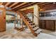 Unfinished basement with exposed wood beam ceiling and staircase at 1185 Wedgefield Sw Dr, Marietta, GA 30064