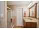 Practical bathroom with a shower, vanity, and neutral tile at 1185 Wedgefield Sw Dr, Marietta, GA 30064