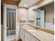 Bathroom featuring long vanity countertop and patterned tile flooring at 1185 Wedgefield Sw Dr, Marietta, GA 30064