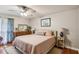 Comfortable bedroom with a king-size bed, dresser, nightstands, and hardwood floors at 1185 Wedgefield Sw Dr, Marietta, GA 30064