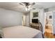 Relaxing bedroom with neutral tones, a ceiling fan, and a view into the ensuite bathroom at 1185 Wedgefield Sw Dr, Marietta, GA 30064