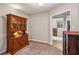 Traditional dining area with carpet, hutch, and doorway to another room at 1185 Wedgefield Sw Dr, Marietta, GA 30064