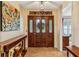 Inviting entryway featuring tiled flooring, a decorative wreath, and views into other rooms with elegant furniture and decor at 1185 Wedgefield Sw Dr, Marietta, GA 30064