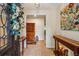 Warm and inviting entryway with tiled flooring, a decorative wreath, and a view into adjacent rooms with stylish furnishings at 1185 Wedgefield Sw Dr, Marietta, GA 30064