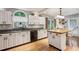 Bright kitchen with white cabinets, stainless steel appliances, and butcher block island at 1185 Wedgefield Sw Dr, Marietta, GA 30064