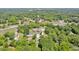 Aerial view of the property in a quiet, tree-filled neighborhood, highlighting the large lot and proximity to amenities at 1382 6Th Ave, Auburn, GA 30011